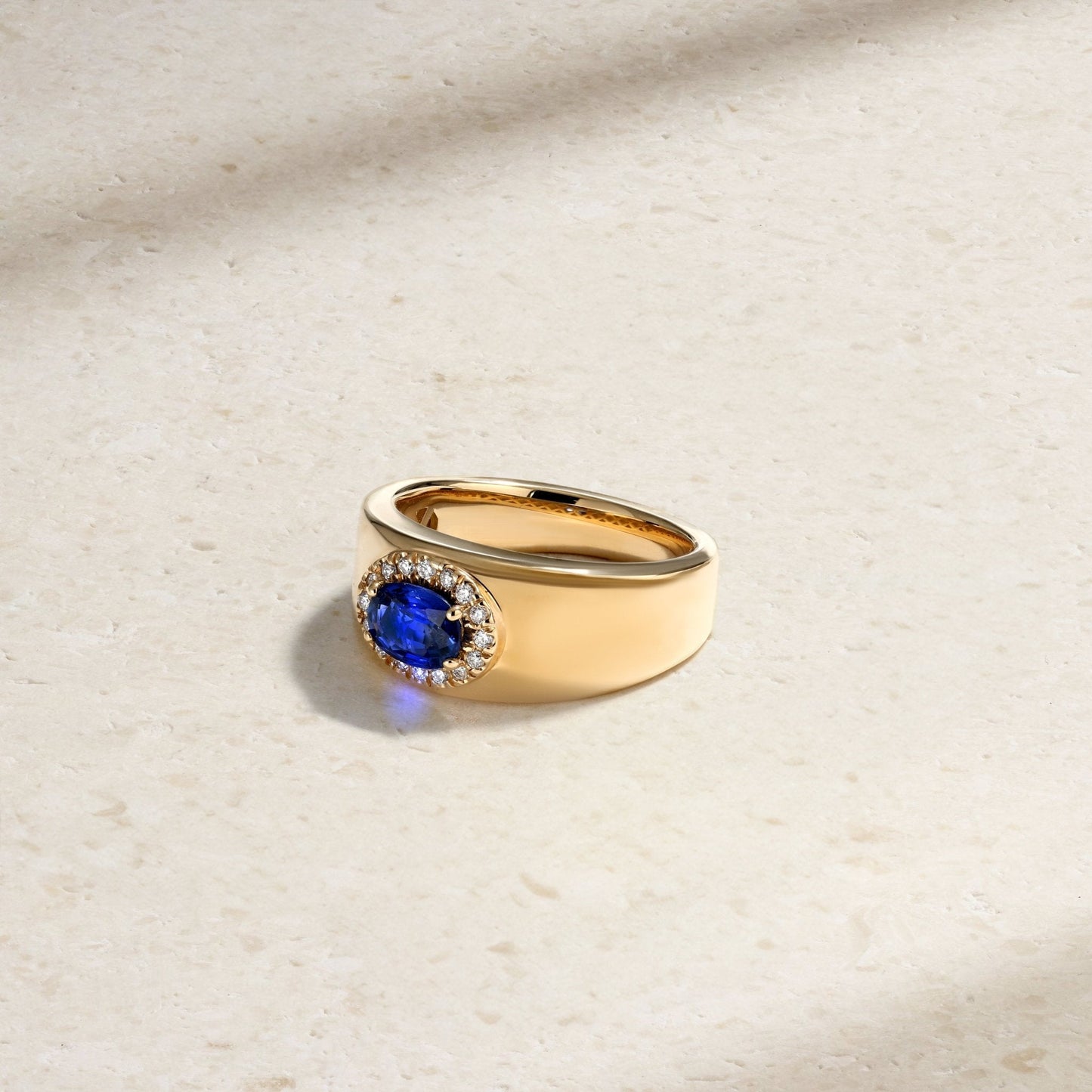 Mark Henry Heirloomed Oval-Cut Sapphire (1.02ct) Cigar Band (18ct yellow gold, size 6.5) with .12ctw diamond halo at Schwanke-Kasten Jewelers (RM5574)