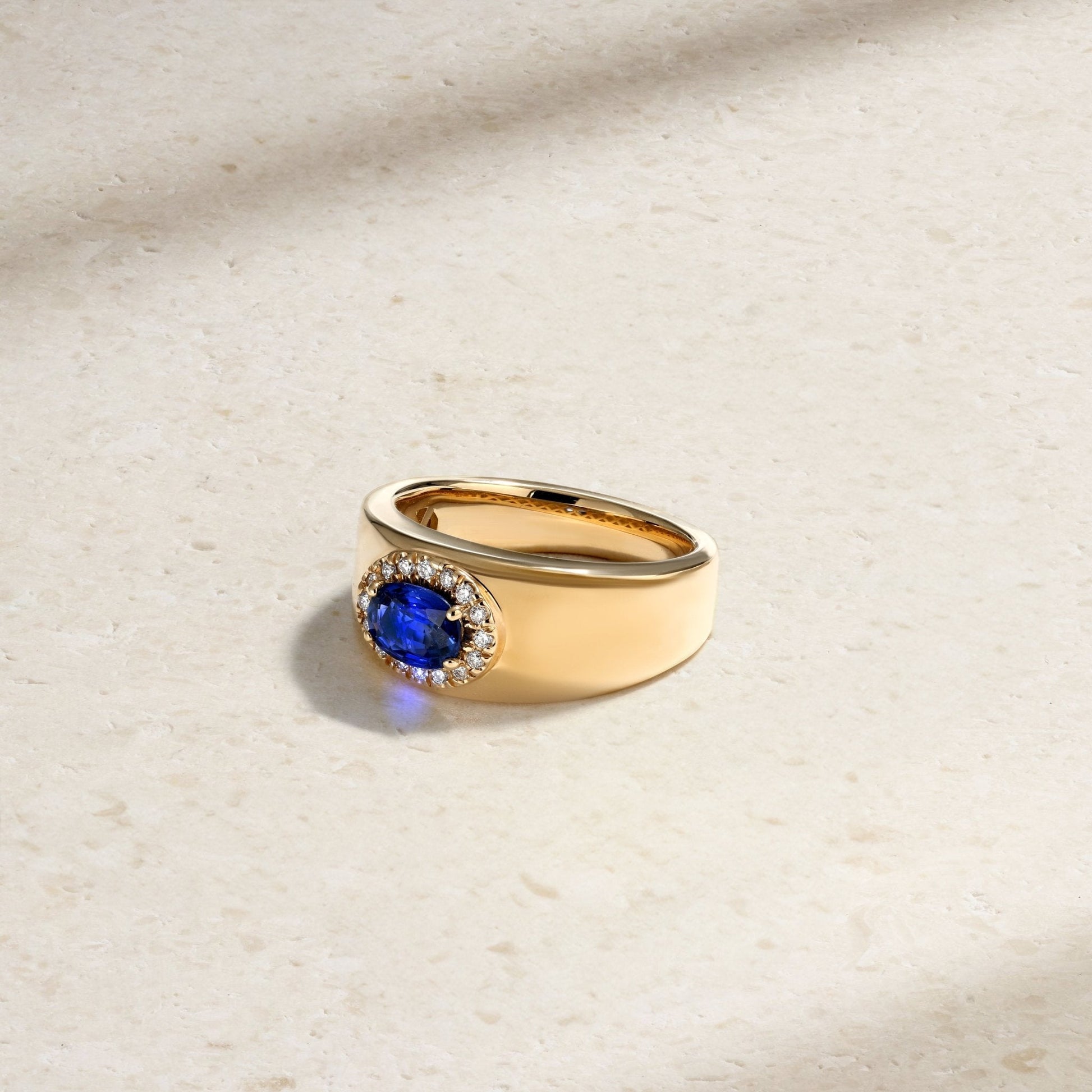 Mark Henry Heirloomed Oval-Cut Sapphire (1.02ct) Cigar Band (18ct yellow gold, size 6.5) with .12ctw diamond halo at Schwanke-Kasten Jewelers (RM5574)