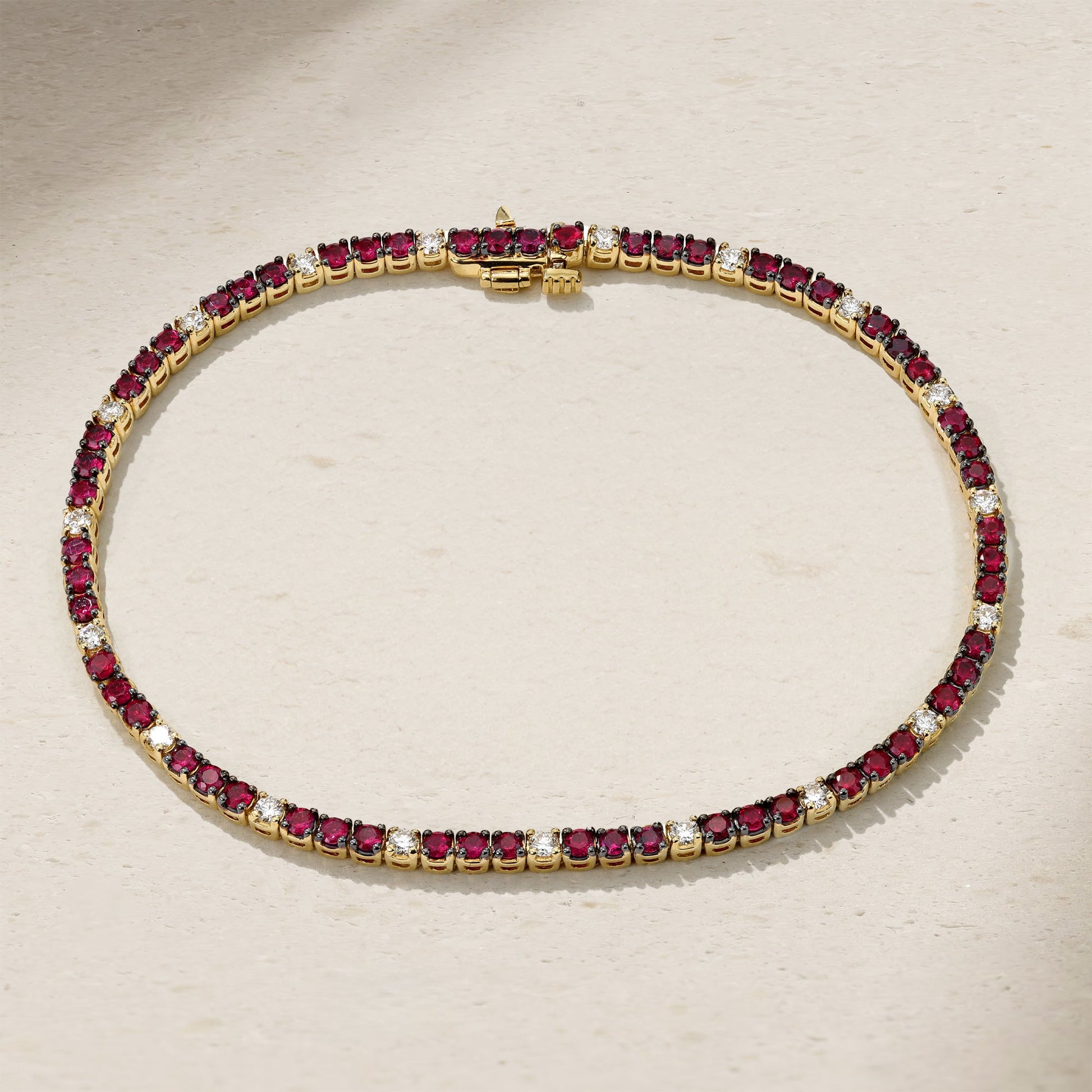 Mark Henry Classic Ruby & Diamond Tennis Bracelet available at Schwanke-Kasten Jewelers in Milwaukee, WI. 7" long with 2ctw ruby, 18ky, .48ctw diamond.