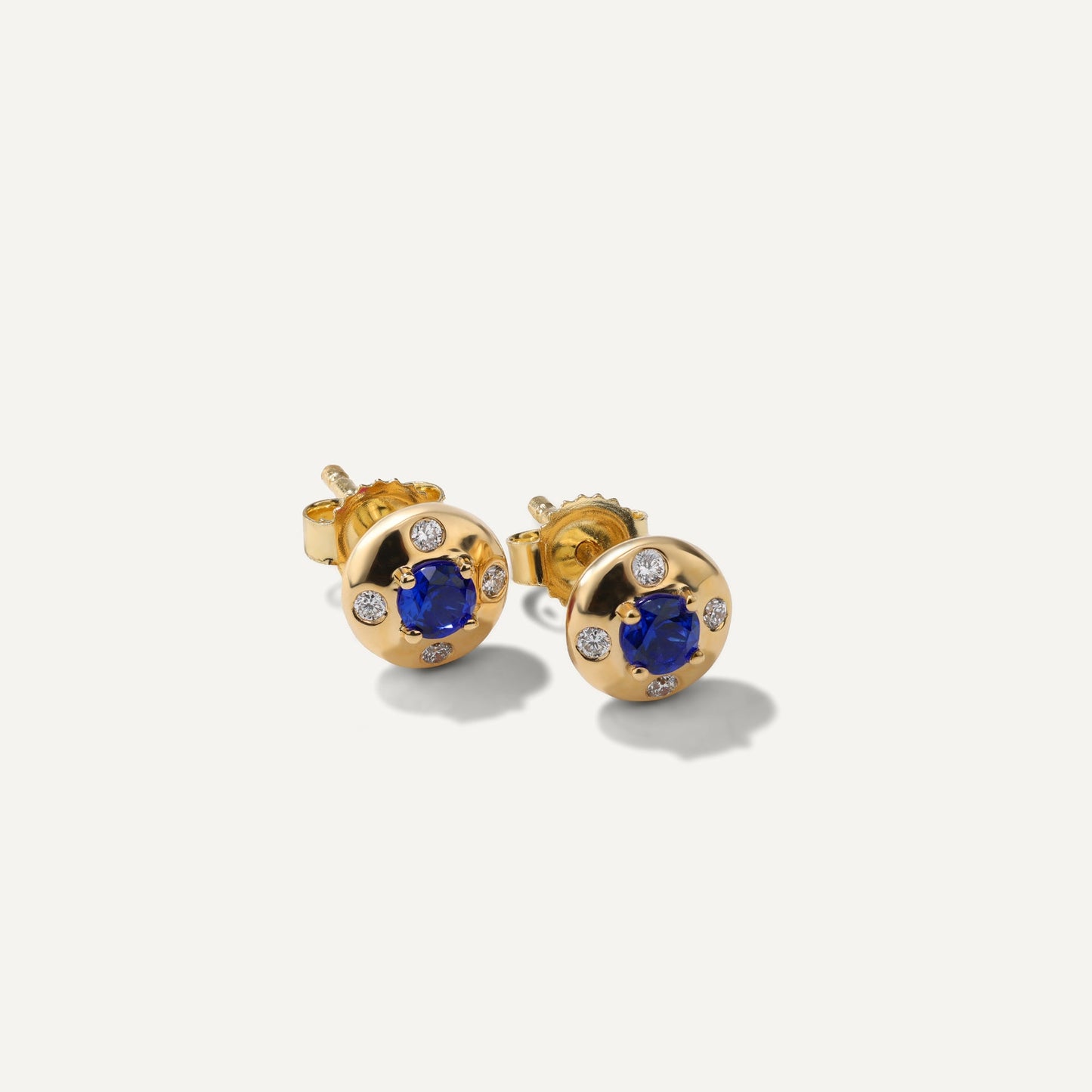 Mark Henry Aurum Petite Round Sapphire (.29ctw) & Diamond (.07ctw) 18ct yellow gold 6mm stud earrings available at Schwanke-Kasten Jewelers