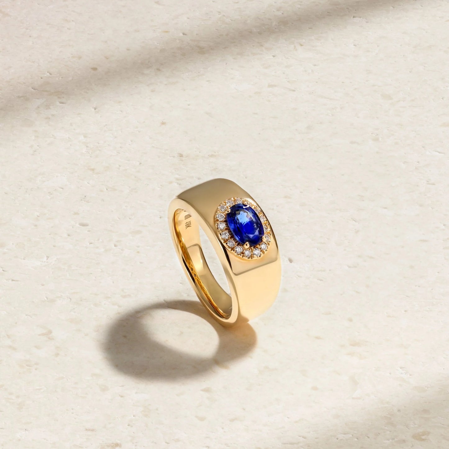 Mark Henry Heirloomed Oval-Cut Sapphire (1.02ct) Cigar Band (18ct yellow gold, size 6.5) with .12ctw diamond halo at Schwanke-Kasten Jewelers (RM5574)
