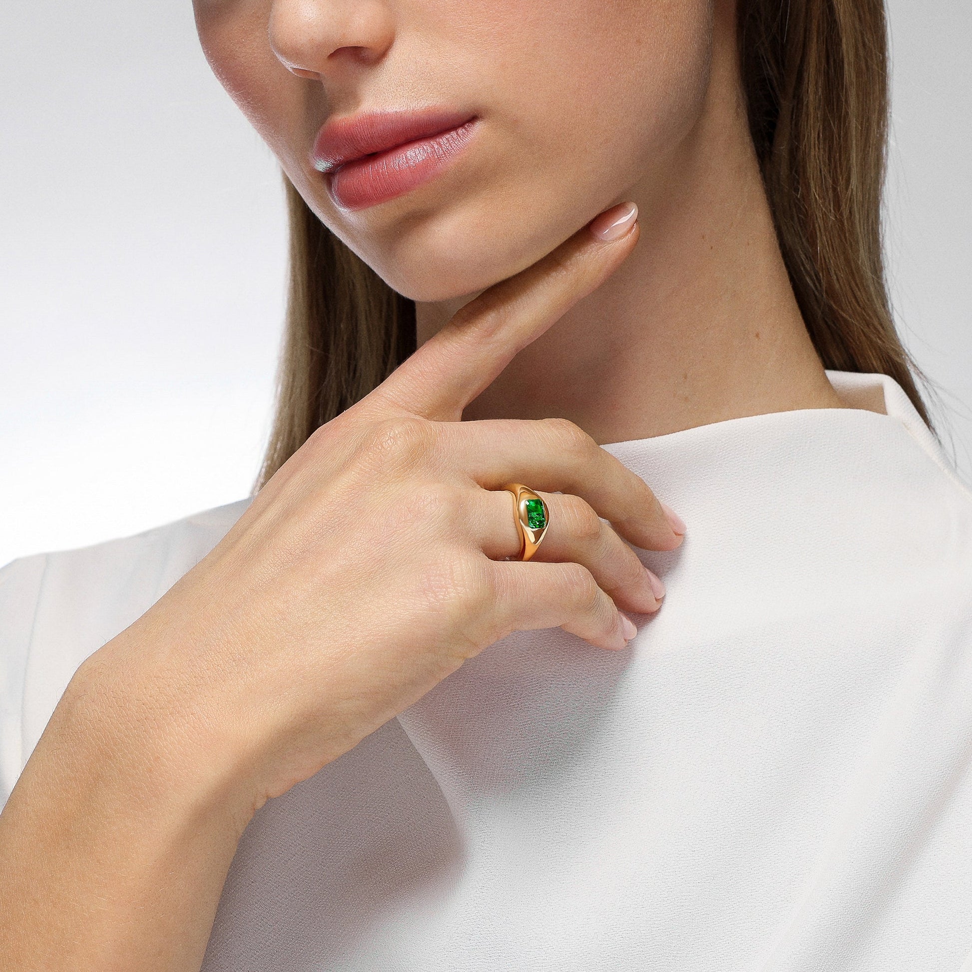 On model Mark Henry Chunky Slim Emerald (.55ct) Signet Ring in 18ct yellow gold, size 6.5 available at Schwanke-Kasten Jewelers in Milwaukee, WI.