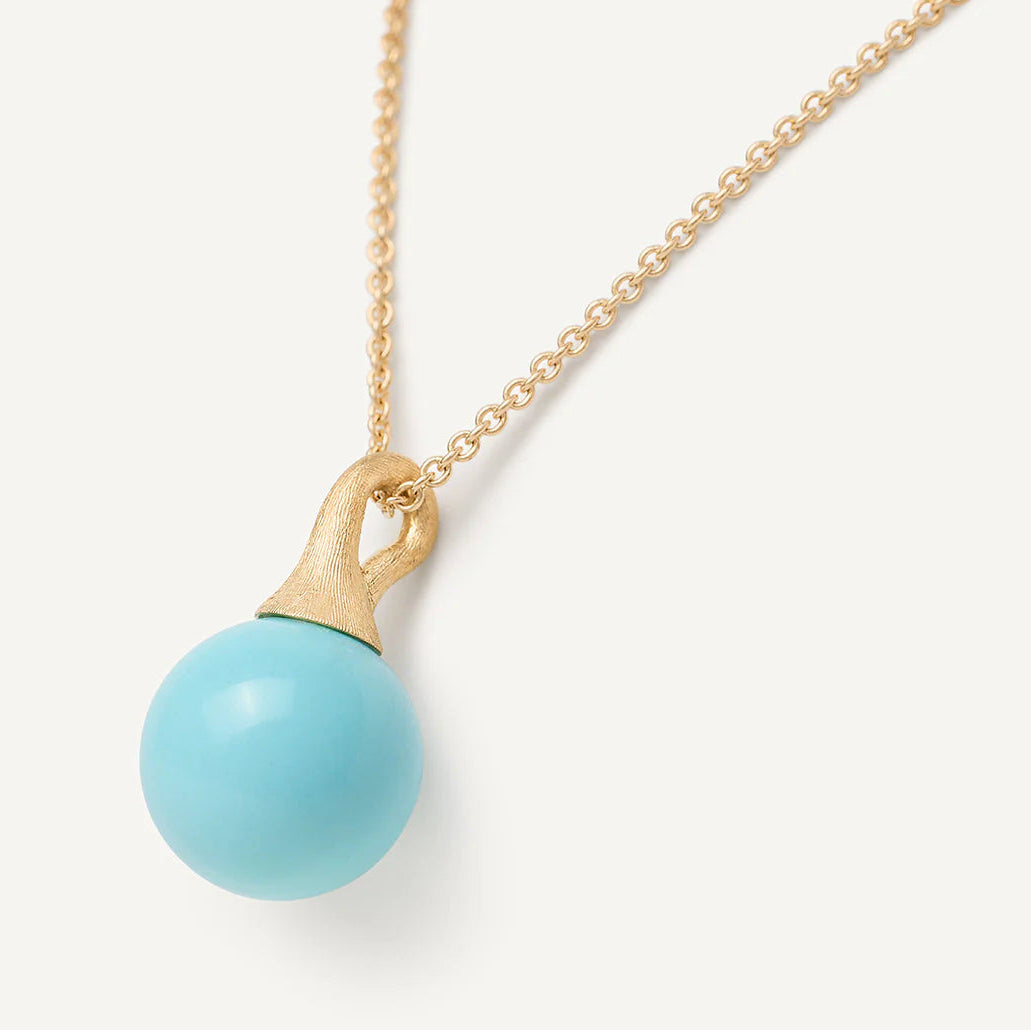 Necklace with a turquoise pendant on a white background