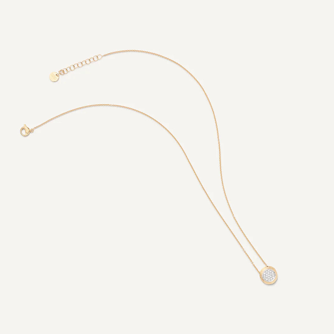 A delicate gold chain necklace with a small circle pendant featuring a halo of gold around a pave diamond disc in white gold, displayed on a light cream background.