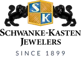 Schwanke-Kasten Jewelers logo with two black cats and a gold shield on a blue background.