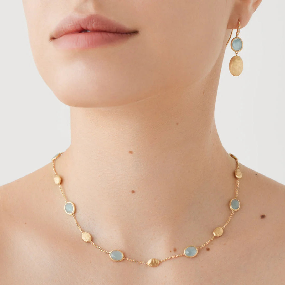Marco Bicego Sivglia french hook earrings in 18k yellow gold with aquamarine station and gold station, adorned with diamonds OB1289-AB_AQ01_Y_02 on model