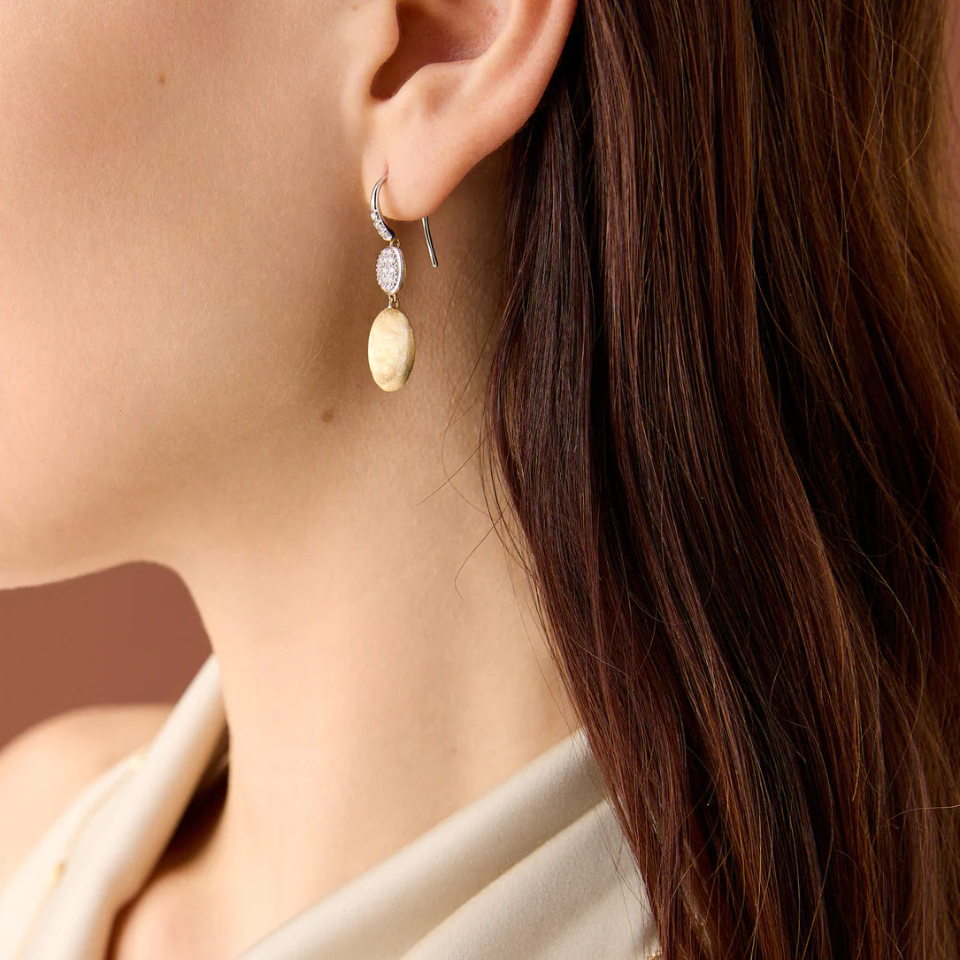 Siviglia Double Diamond Drops in 18ct yellow and white gold, with french hook, pave set diamonds. Marco Bicego on model